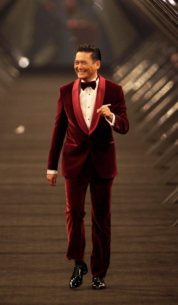 Hong Kong actor Chow Yun-fat smiles as he presents a Hugo Boss creation during the BOSS Black fall/winter 2012 fashion show by Hugo Boss in Beijing, May 18, 2012. REUTERS/Soo Hoo Zheyang (CHINA - Tags: ENTERTAINMENT FASHION TPX IMAGES OF THE DAY)